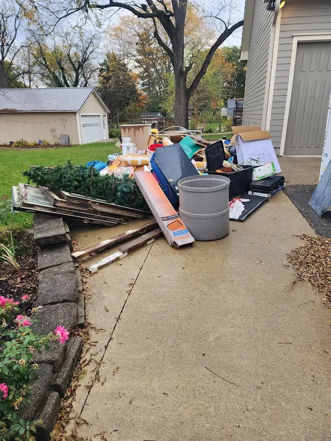Dumpster being loaded with debris for 10 Yard Dumpster Rental in Vashon